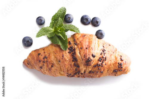 croissant with blueberries isolated on white