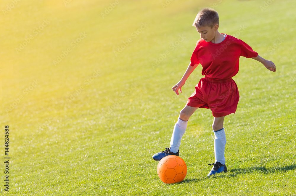 Kids soccer football - children players match on soccer field Kids soccer football - children players match on soccer field