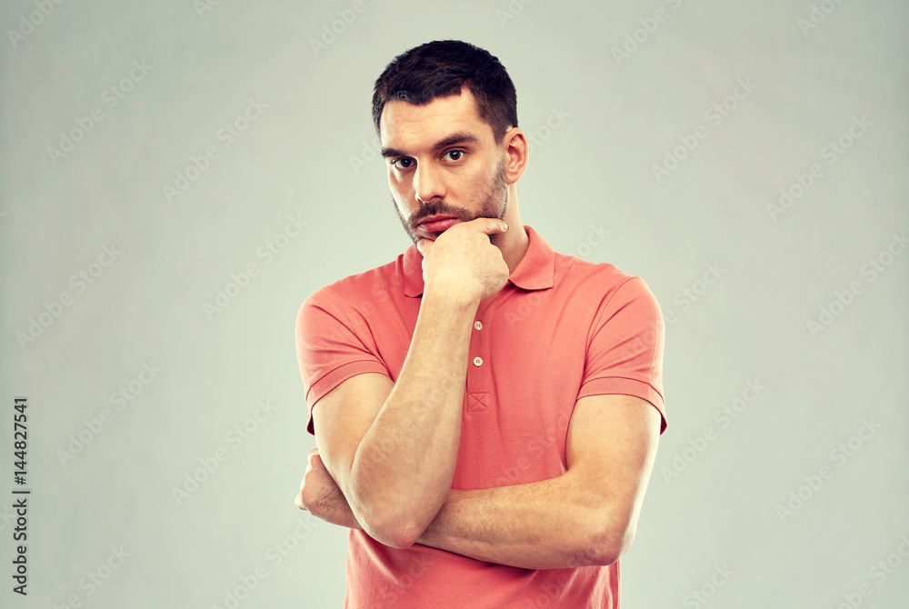 man thinking over gray background man thinking over gray background