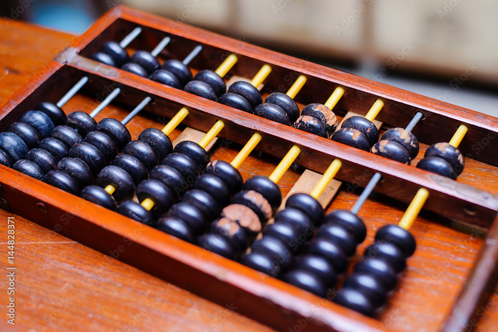 Old wooden abacus on wooden background Old wooden abacus on wooden background
