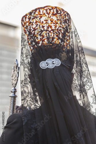 Woman dressed in mantilla during a procession of holy week, Spain