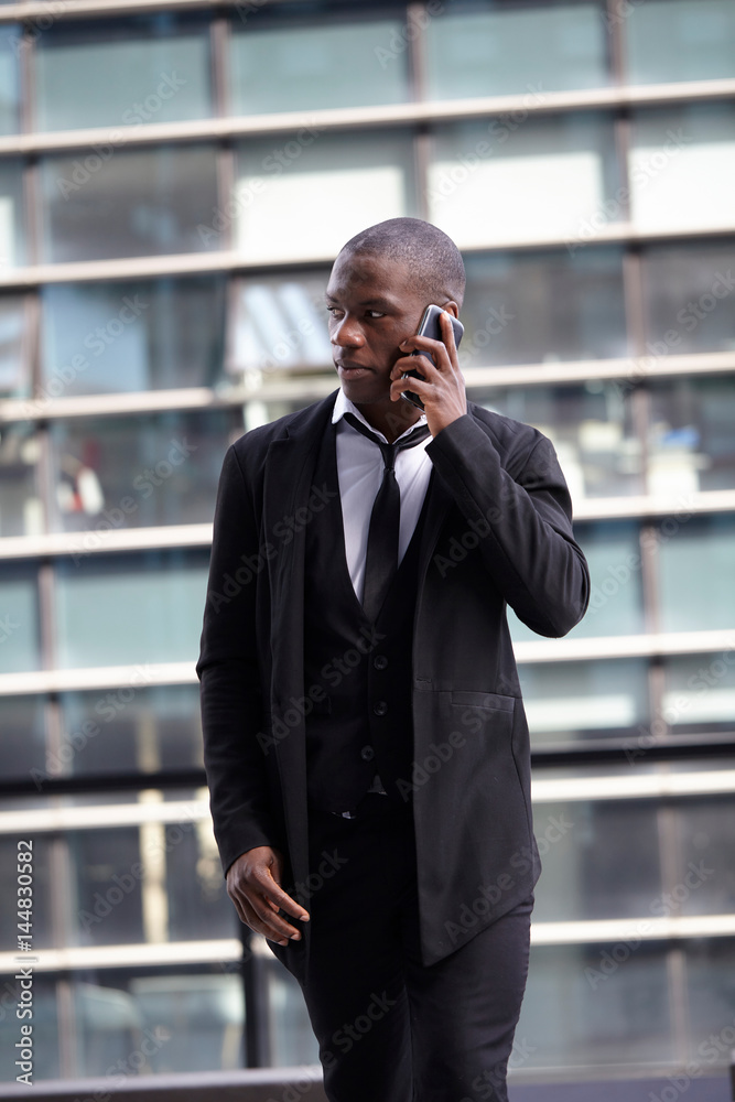 Young businessman calls on mobile in downtown Young businessman calls on mobile in downtown