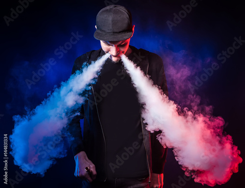 Men with beard vaping outdo...