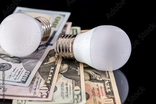led bulb with usa money isolated on a white background