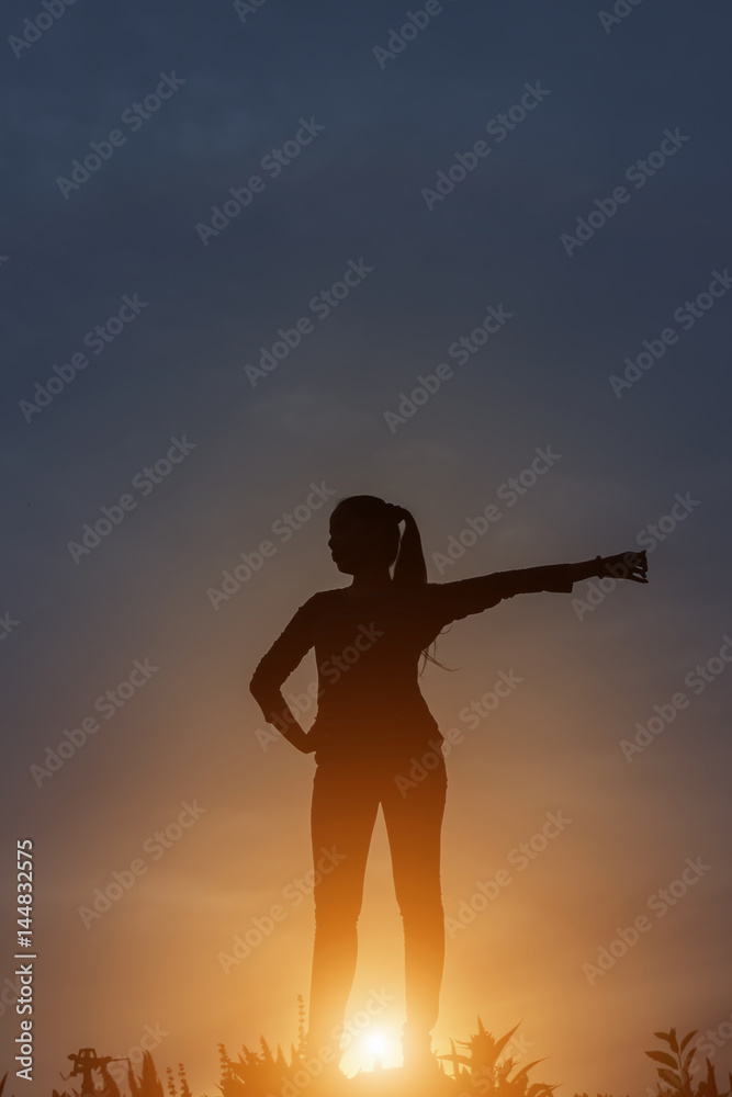 silhouette of a happy people and sunset