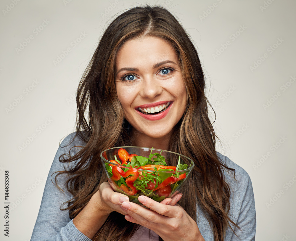 close up face of woman with salad isolated portrait. close up face of woman with salad isolated portrait.