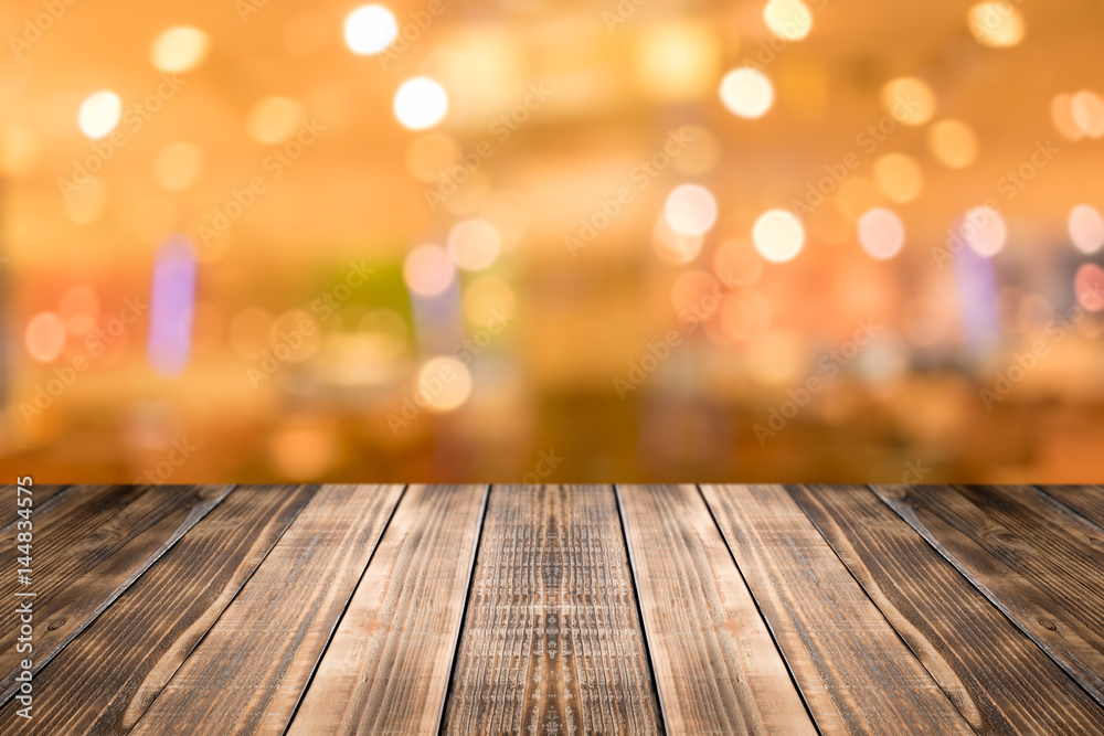 Old wood table top on blurred background,Space available for the product