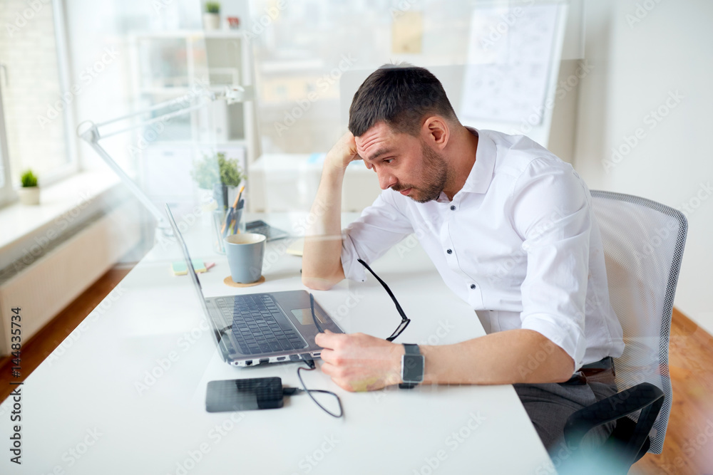 stressed businessman with laptop at office stressed businessman with laptop at office