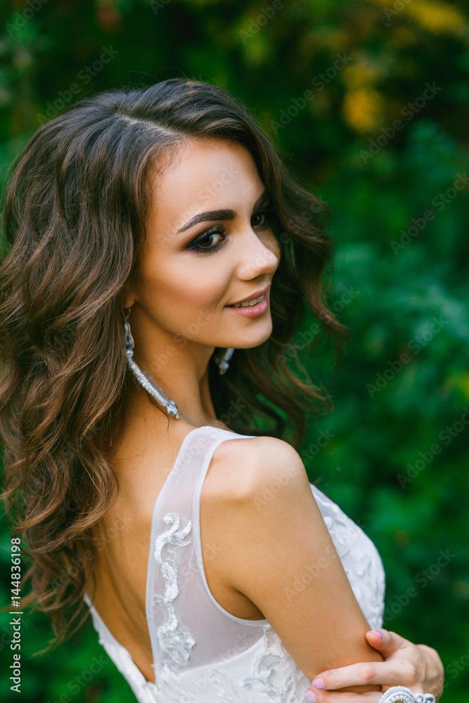 Beautiful young bride with long curly hair Beautiful young bride with long curly hair