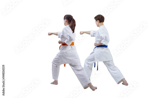 Girls are training punch hand against a white background