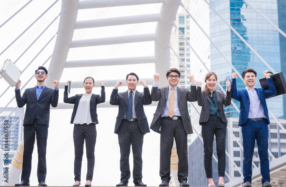 happy Successful business group People Hands Raised successful with city background Successful business group with arms up with city background happy Successful business group People Hands Raised successful with city background Successful business group with arms up with city background