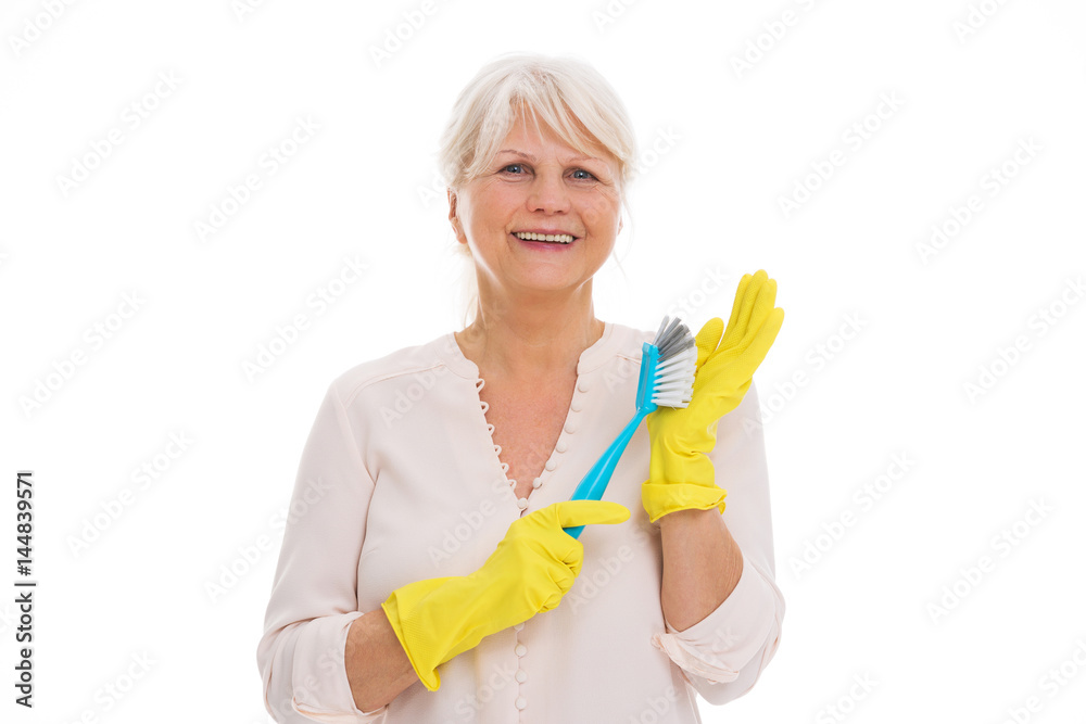 Senior woman with cleaning supplies and rubber gloves
Senior woman with cleaning supplies and rubber gloves
