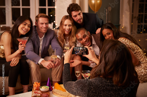 Friends Posing For Photo As They Have Fun At Party Together