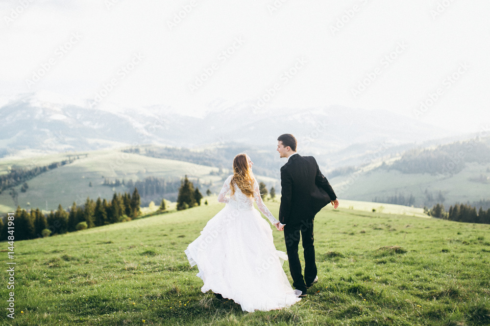 Beautiful bride and groom at the mountains Beautiful bride and groom at the mountains