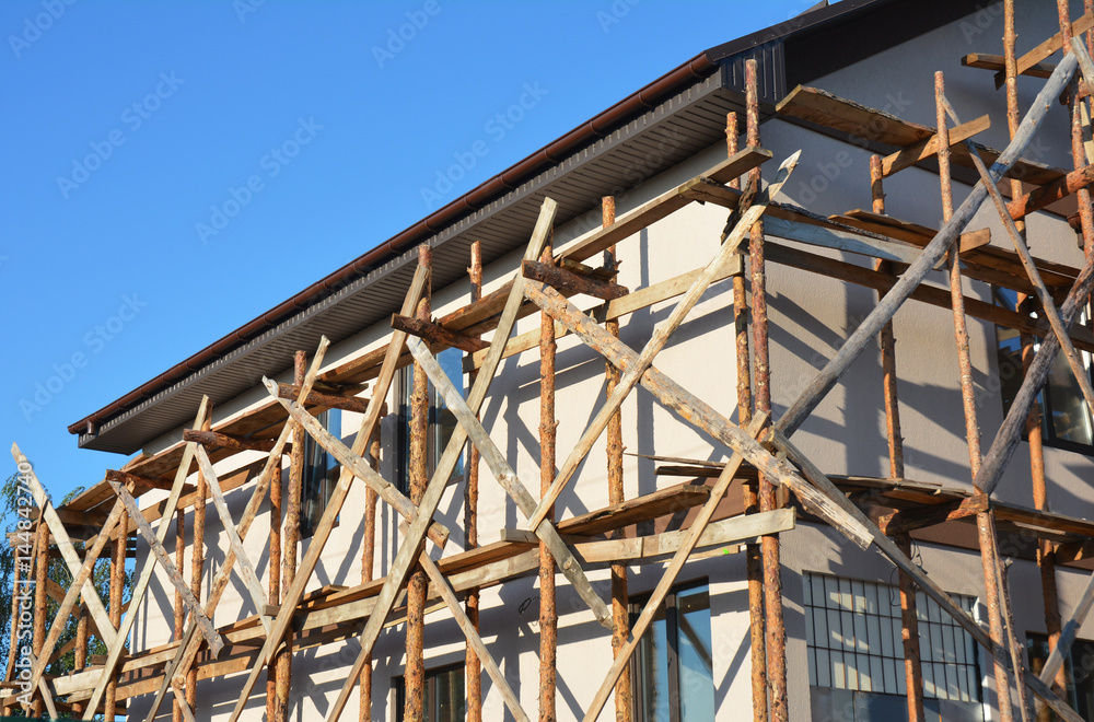 Plastering wall. Wall Insulation. Roof repair. Building Insulation. Unfinished house with wall insulation and plastering walls. Plastering wall. Wall Insulation. Roof repair. Building Insulation. Unfinished house with wall insulation and plastering walls.