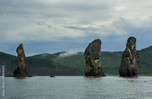 Three Brothers Rocks in the Avacha Bay of Pacific Ocean. Coast of Kamchatka.