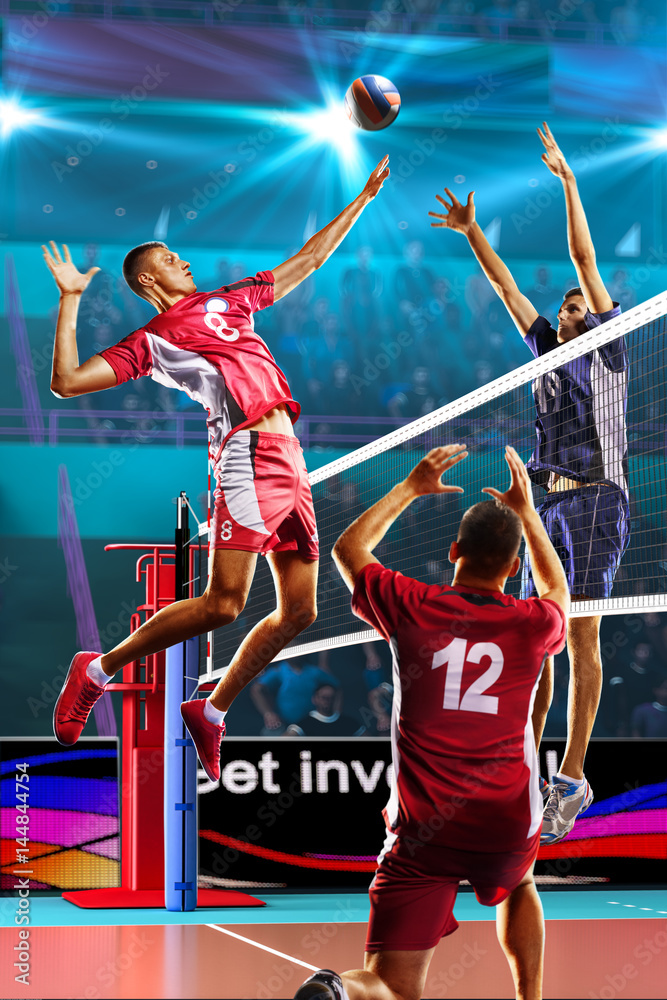 Professional volleyball players in action on the grand court - obrazy, fototapety, plakaty 
