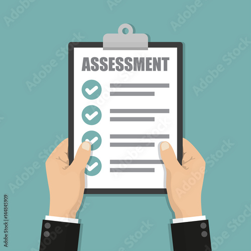 Businessman hands holding clipboard checklist with assessment