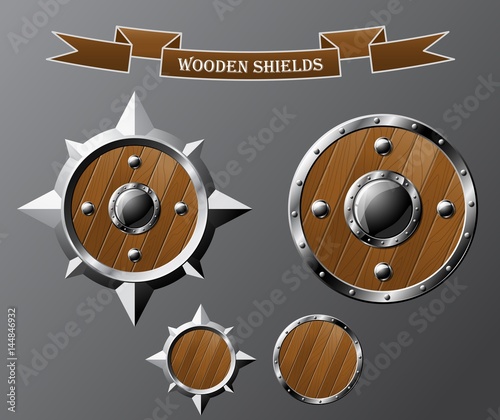 Set of realistic wooden shields isolated on grey. Vector illustration.