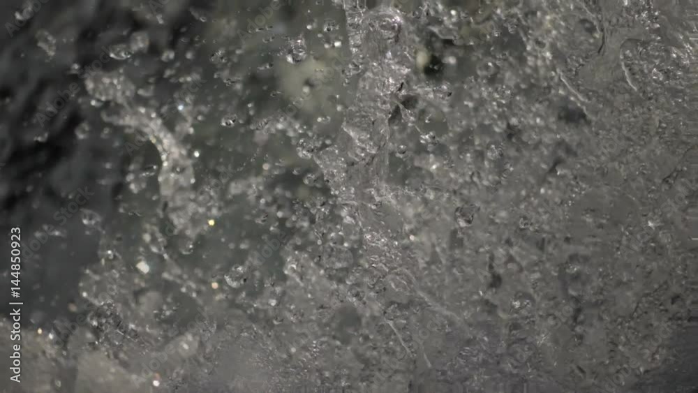 Super slow motion water floating down a cascade of a river, close, in HD Super slow motion water floating down a cascade of a river, close, in HD