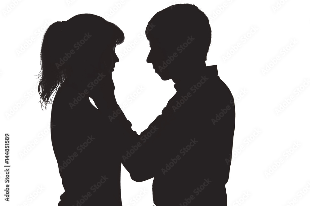 Silhouette of a man touching the face of his beloved woman o