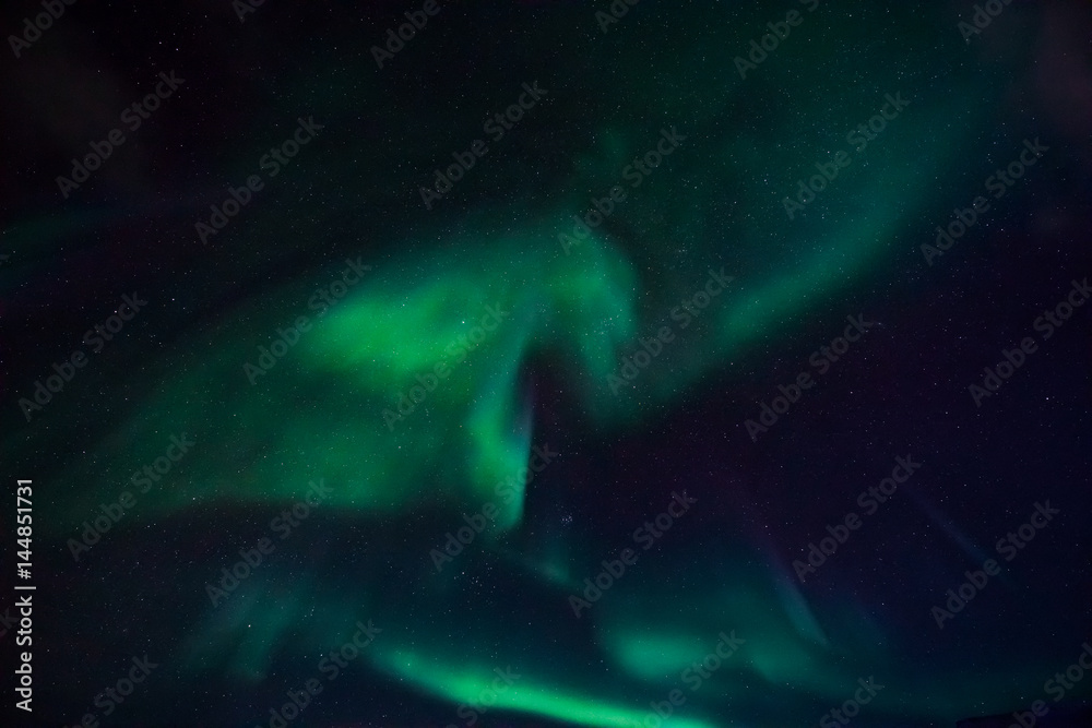 Fototapeta premium The polar Northern lights in the mountains of Svalbard, Longyearbyen, Spitsbergen, Norway wallpaper