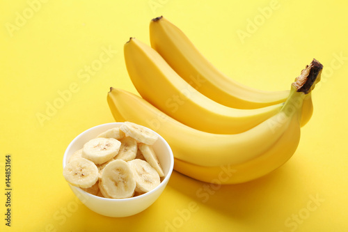 Sweet bananas on the yellow background