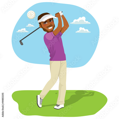 Young African American golfer hitting a golf ball with golf driver