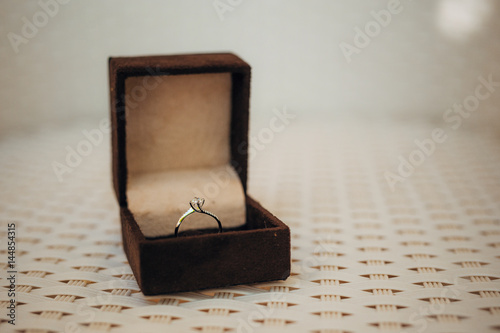 Wedding rings of the newlyweds in a box. Engagement gold rings. Wedding in Montenegro. © Nadtochiy