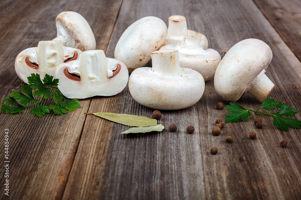 Mushrooms, spices on the wooden background Mushrooms, spices on the wooden background