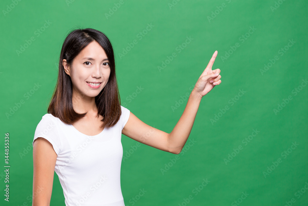 Young woman showing finger point up