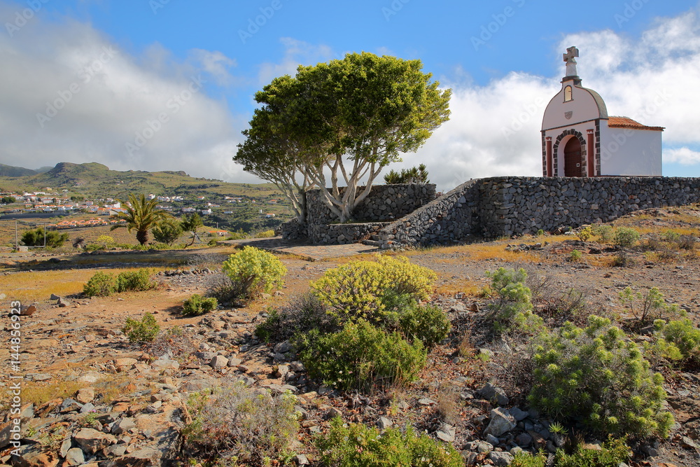 ALAJERO, LA GOMERA, SPAIN: View of the chapel San Isodor with the village of Alajero in the background