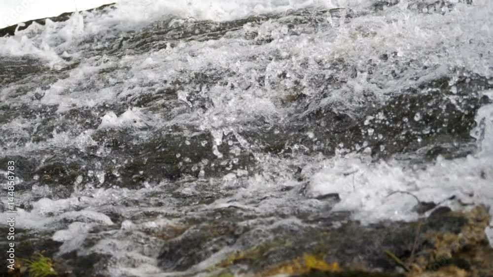 Super slow motion water floating down a cascade of a river, close, in HD Super slow motion water floating down a cascade of a river, close, in HD