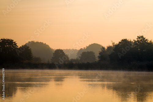 Morning fog above lake. © cegli