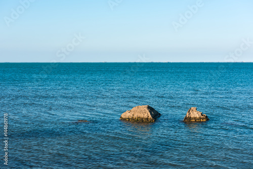 Coast with rocks and blue water