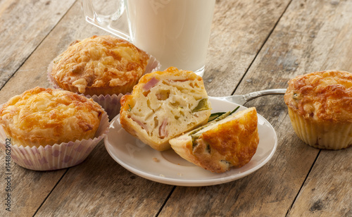 Photography Savory cheese and bacon muffins on the wooden table