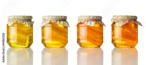 Different Colors of Honey in Jar on White Background