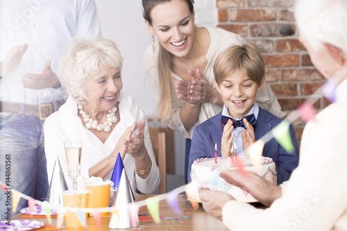 Child celebrating birthday with family