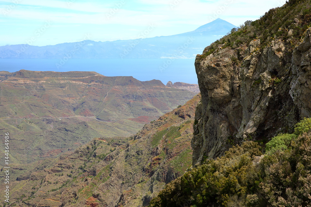 LA GOMERA, SPAIN: View of mountainous landscape from the Mirador Degollada de Peraza towards Teide Volcano (in Tenerife Island)