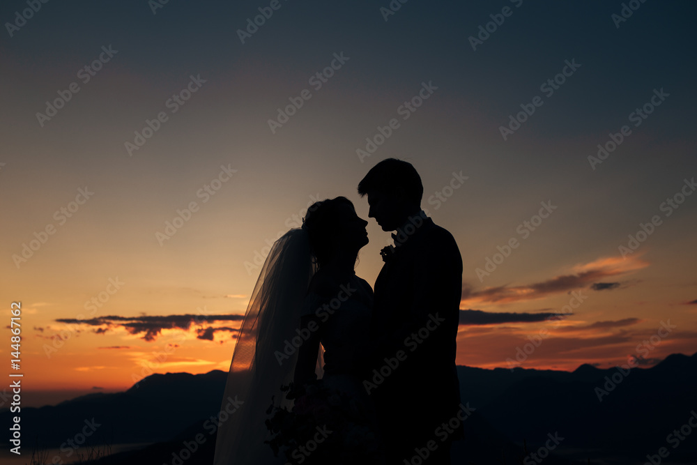 Silhouettes at sunset on Mount Lovcen in Montenegro