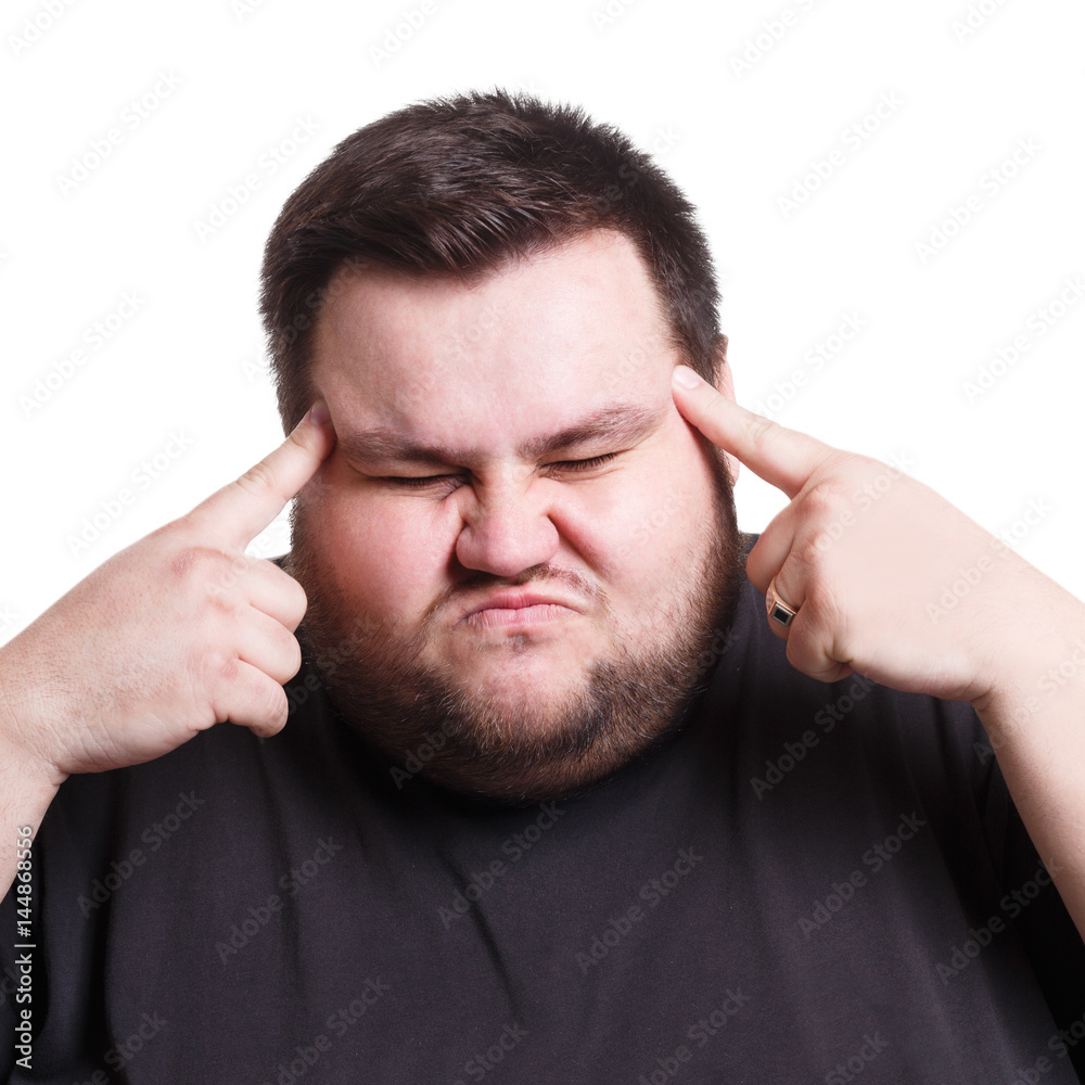 Man suffering from headache, isolated shot Man suffering from headache, isolated shot