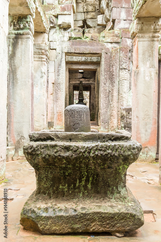 The sacred stone lignum and yoni sculpture in the Preah Khan ruins, Cambodia. The cylindrical stone is believed to have male power and the surrounding, larger stone is female.