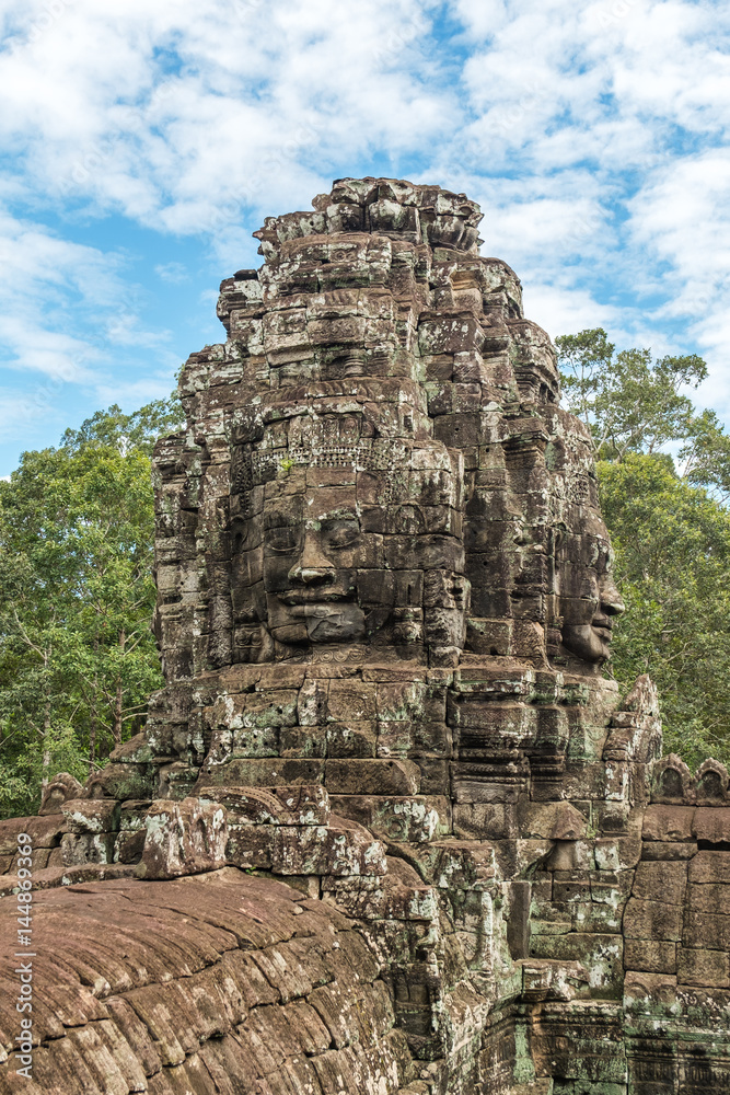 Giant face stone carving faces of Bayon temple in Angkor Thom, Siemreap, Cambodia
