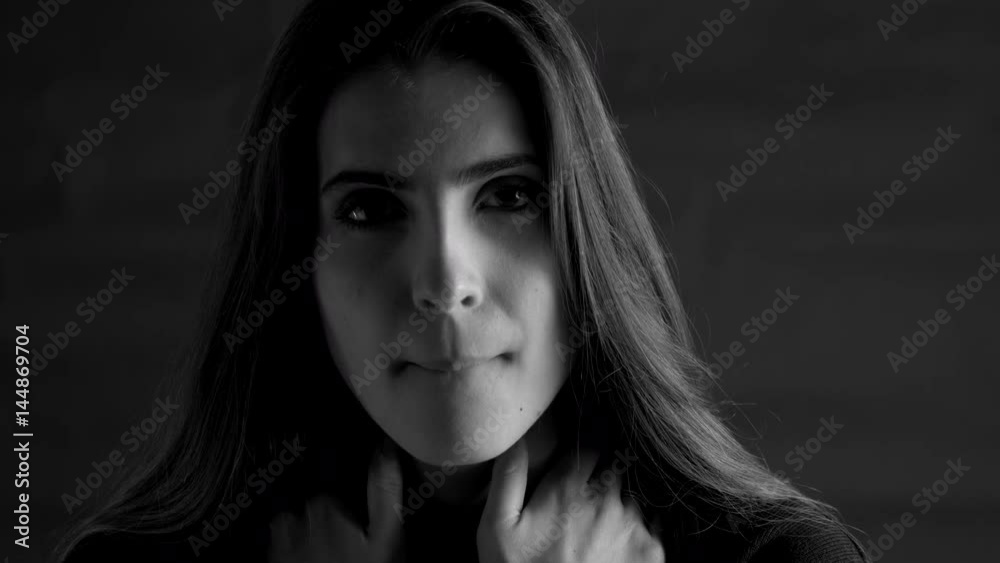 Beautiful woman looking strong intense camera black and white Beautiful woman looking strong intense camera black and white