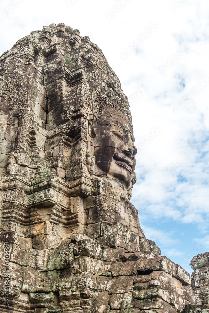 Giant face stone carving faces of Bayon temple in Angkor Thom, Siemreap, Cambodia Giant face stone carving faces of Bayon temple in Angkor Thom, Siemreap, Cambodia