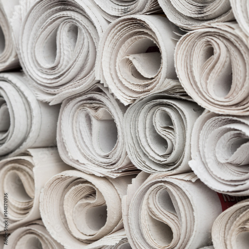 Rolls of newspapers.