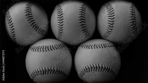 Baseball image for sports background, can see balls with vintage game appeal. Represents the american sport lifestyle in black and white.