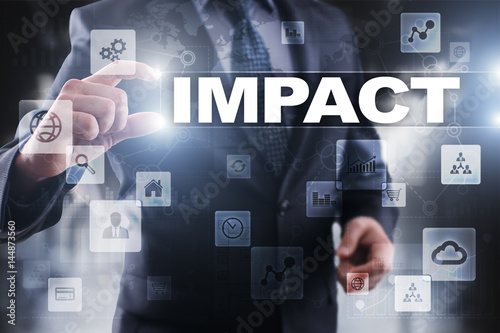 Принти на полотні Businessman selecting impact on virtual screen.
