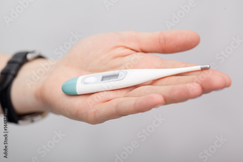 Sick women with a thermometer