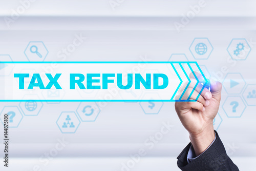 Businessman drawing on virtual screen. tax refund concept.